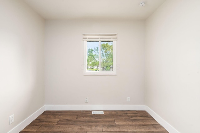 4795 Hafey Ave, Columbus, OH 43228 - empty room featuring dark wood finished floors, baseboards, and a smoke detector