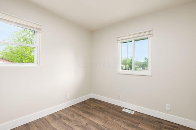 4795 Hafey Ave, Columbus, OH 43228 - spare room featuring baseboards, healthy amount of natural light, and dark wood finished floors