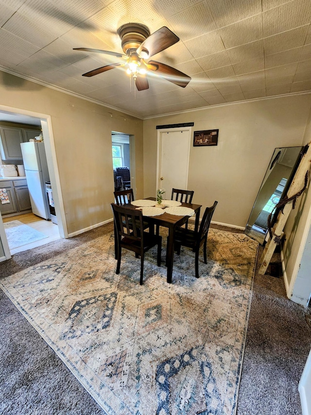 750 S 9th St, Cambridge, OH 43725 - dining space with ornamental molding, carpet, a ceiling fan, and baseboards