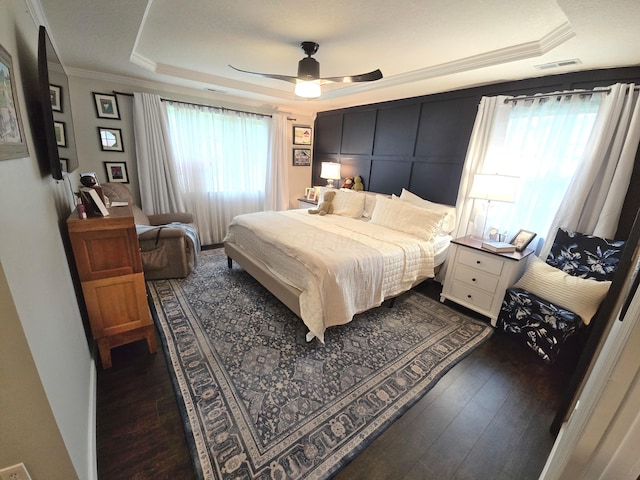 154 Pioneer Cir, Pickerington, OH 43147 - bedroom featuring a tray ceiling, ornamental molding, wood-type flooring, and ceiling fan