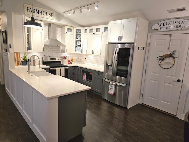 154 Pioneer Cir, Pickerington, OH 43147 - kitchen with wall chimney range hood, appliances with stainless steel finishes, lofted ceiling, backsplash, and a sink