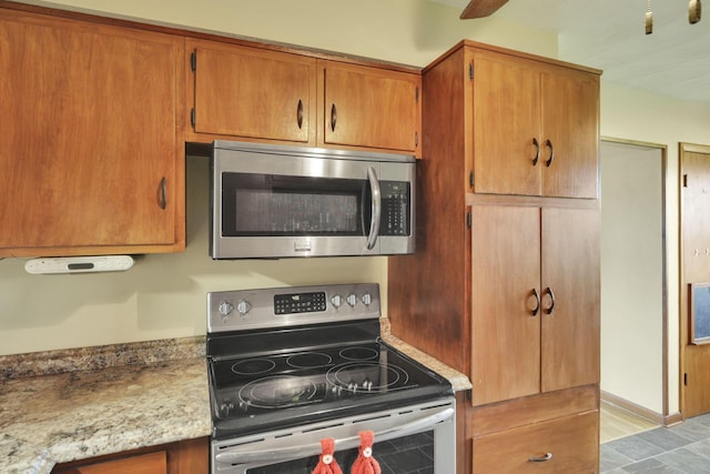 2320 Miller Paul Rd, Galena, OH 43021 - kitchen with appliances with stainless steel finishes and brown cabinetry