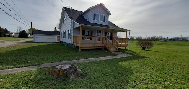 16 W Walnut St, Jeffersonville, OH 43128 - view of front of property featuring a porch, a front yard, and a detached garage