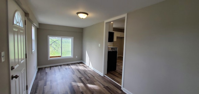 16 W Walnut St, Jeffersonville, OH 43128 - foyer entrance featuring dark wood finished floors and baseboards