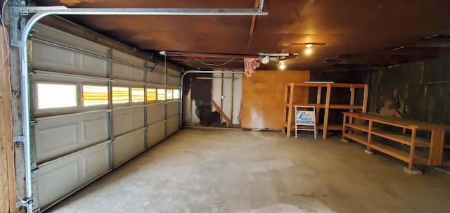 16 W Walnut St, Jeffersonville, OH 43128 - garage featuring a garage door opener