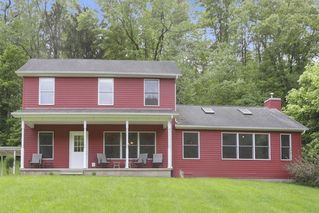 7485 Sugar Grove Rd SE, Sugar Grove, OH 43155 - rear view of house with a porch, a chimney, a yard, and view of scattered trees