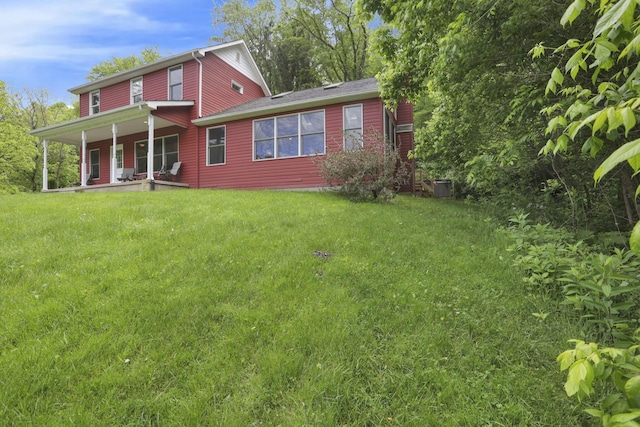 7485 Sugar Grove Rd SE, Sugar Grove, OH 43155 - back of house with covered porch and a lawn