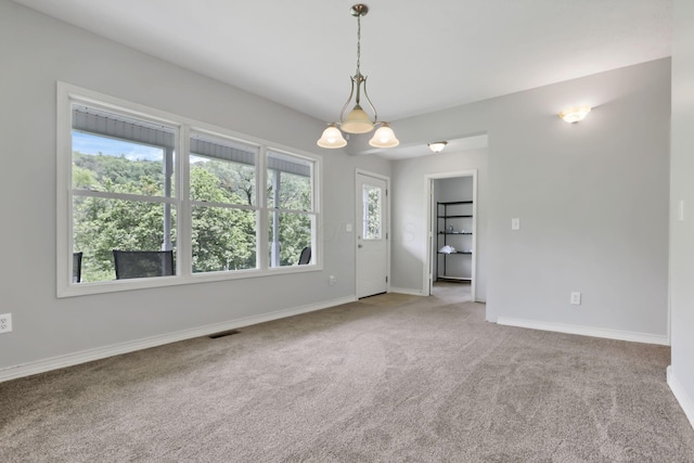 7485 Sugar Grove Rd SE, Sugar Grove, OH 43155 - empty room featuring carpet flooring, baseboards, and a chandelier