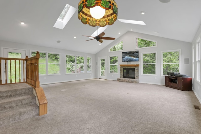 7485 Sugar Grove Rd SE, Sugar Grove, OH 43155 - unfurnished living room featuring a skylight, high vaulted ceiling, a stone fireplace, baseboards, and healthy amount of natural light
