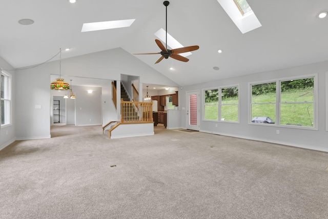 7485 Sugar Grove Rd SE, Sugar Grove, OH 43155 - unfurnished living room with a skylight, light colored carpet, baseboards, stairs, and high vaulted ceiling