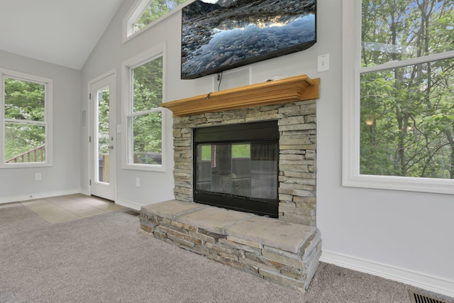 7485 Sugar Grove Rd SE, Sugar Grove, OH 43155 - unfurnished living room with carpet, a fireplace, healthy amount of natural light, vaulted ceiling, and baseboards