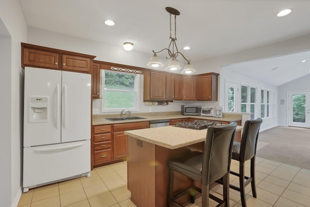 7485 Sugar Grove Rd SE, Sugar Grove, OH 43155 - kitchen featuring stainless steel appliances, a sink, light countertops, vaulted ceiling, and light carpet