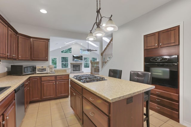 7485 Sugar Grove Rd SE, Sugar Grove, OH 43155 - kitchen featuring black appliances, vaulted ceiling, light tile patterned floors, a kitchen island, and a breakfast bar area