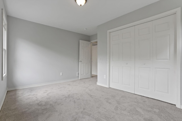7485 Sugar Grove Rd SE, Sugar Grove, OH 43155 - unfurnished bedroom with carpet flooring, baseboards, and a closet