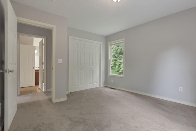 7485 Sugar Grove Rd SE, Sugar Grove, OH 43155 - unfurnished bedroom with carpet floors, a closet, and baseboards
