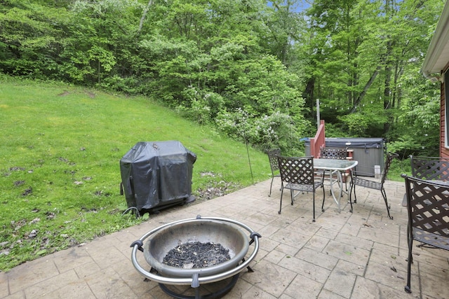 7485 Sugar Grove Rd SE, Sugar Grove, OH 43155 - view of patio / terrace featuring a hot tub, area for grilling, outdoor dining space, and a fire pit