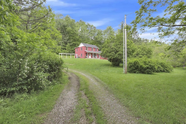 7485 Sugar Grove Rd SE, Sugar Grove, OH 43155 - view of grassy yard featuring driveway and a forest view