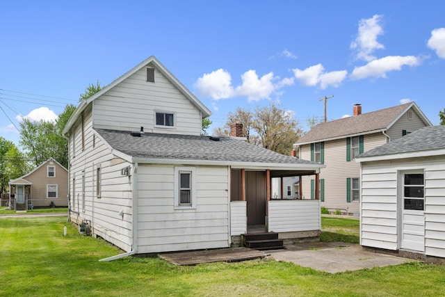 482 E Farming St, Marion, OH 43302 - rear view of property with a yard and roof with shingles