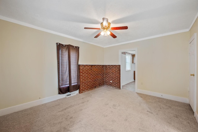 482 E Farming St, Marion, OH 43302 - empty room featuring ceiling fan, carpet, crown molding, baseboards, and a tiled fireplace