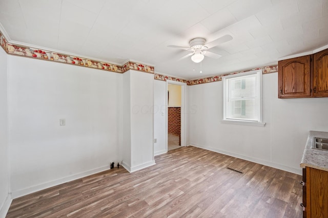 482 E Farming St, Marion, OH 43302 - unfurnished room featuring ceiling fan, light wood-style floors, and baseboards