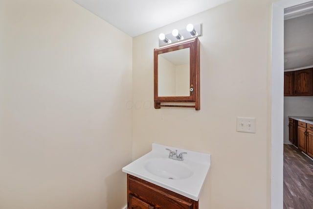 482 E Farming St, Marion, OH 43302 - bathroom featuring vanity, wood finished floors, and baseboards