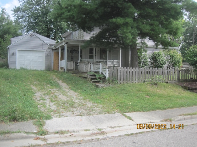 781 Xenia Ave, Xenia, OH 45385 - view of front of house with a porch, a detached garage, and driveway