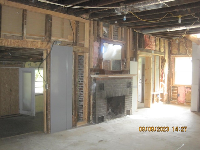 781 Xenia Ave, Xenia, OH 45385 - unfurnished living room featuring a brick fireplace
