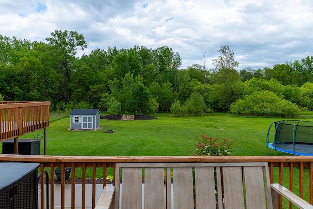 471 Quaker Trce, Marengo, OH 43334 - view of green lawn featuring a trampoline and a deck