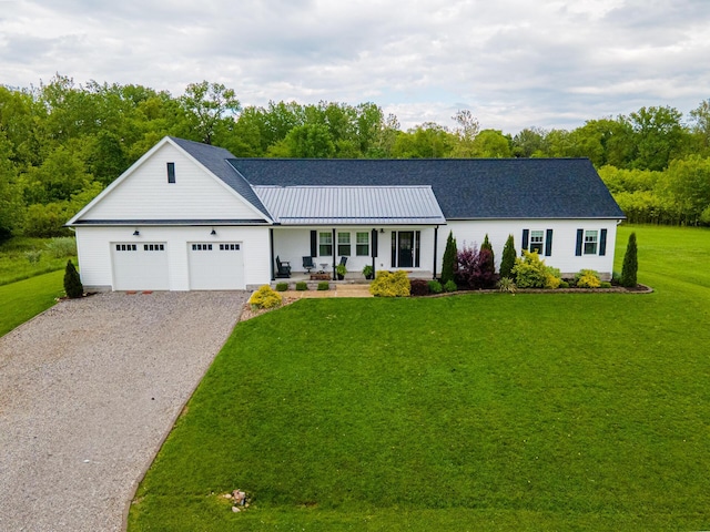 471 Quaker Trce, Marengo, OH 43334 - single story home featuring gravel driveway, a porch, a front lawn, an attached garage, and a standing seam roof