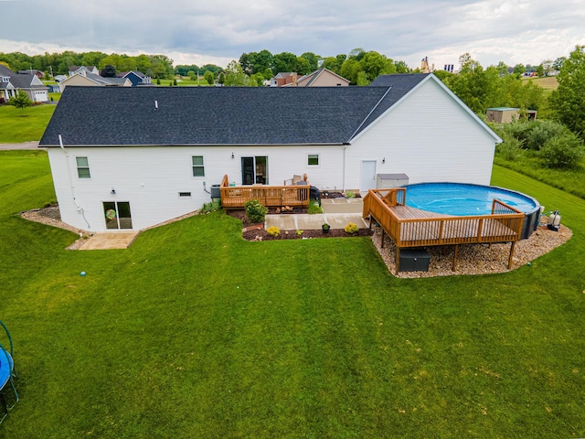471 Quaker Trce, Marengo, OH 43334 - rear view of house featuring a wooden deck, a lawn, and an outdoor pool