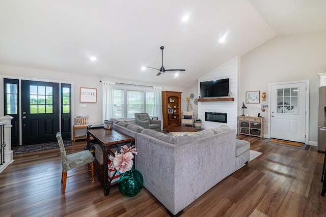 471 Quaker Trce, Marengo, OH 43334 - living area with a large fireplace, a ceiling fan, plenty of natural light, dark wood-style flooring, and high vaulted ceiling