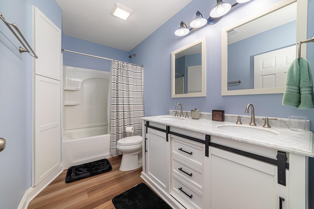 471 Quaker Trce, Marengo, OH 43334 - full bath with double vanity, wood finished floors, shower / tub combo, and toilet