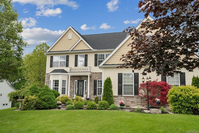 161 Calumet Ct, Ostrander, OH 43061 - view of front of property with stone siding, a front yard, and roof with shingles