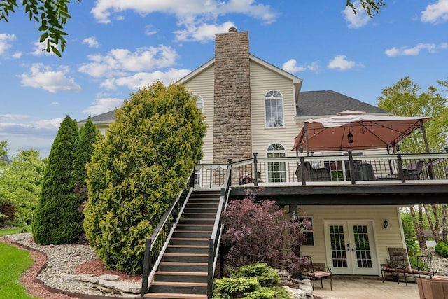 161 Calumet Ct, Ostrander, OH 43061 - rear view of property with french doors, a gazebo, a deck, stairs, and a chimney