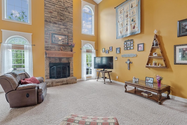 161 Calumet Ct, Ostrander, OH 43061 - living room featuring a towering ceiling, baseboards, carpet flooring, and a fireplace
