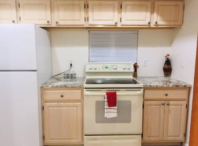 661 E 11th Ave, Columbus, OH 43211 - kitchen featuring white appliances, light brown cabinets, and light stone counters