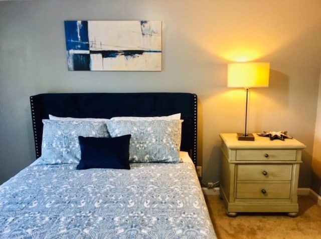 661 E 11th Ave, Columbus, OH 43211 - carpeted bedroom featuring baseboards
