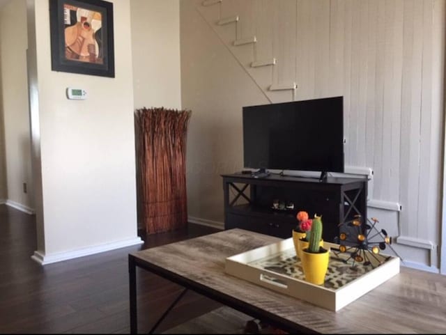 661 E 11th Ave, Columbus, OH 43211 - living room with baseboards, wood finished floors, and stairs