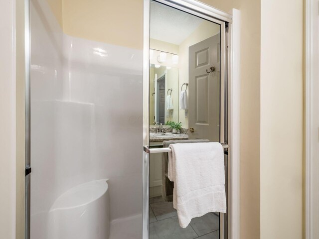 38 Ironclad Dr, Columbus, OH 43213 - full bath with vanity, a shower, and tile patterned floors