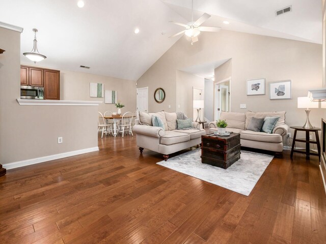 38 Ironclad Dr, Columbus, OH 43213 - living area with high vaulted ceiling, ceiling fan, dark wood finished floors, baseboards, and recessed lighting
