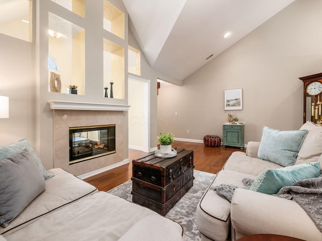 38 Ironclad Dr, Columbus, OH 43213 - living room with wood finished floors, high vaulted ceiling, a high end fireplace, baseboards, and recessed lighting