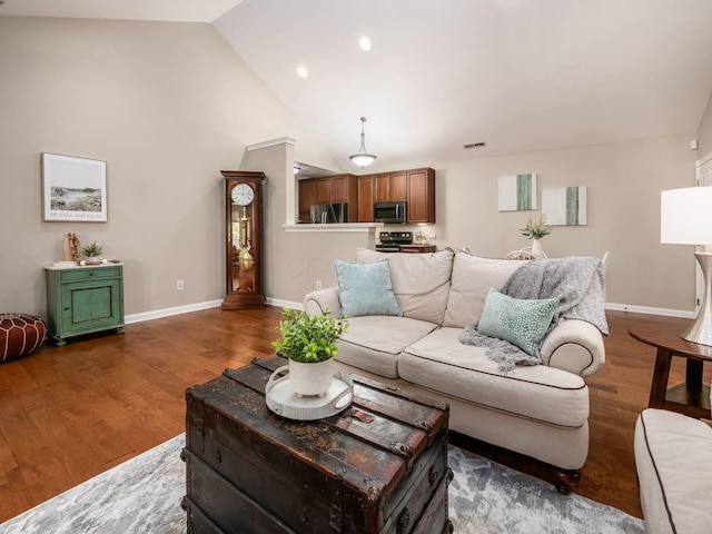 38 Ironclad Dr, Columbus, OH 43213 - living area with wood finished floors, baseboards, high vaulted ceiling, and recessed lighting