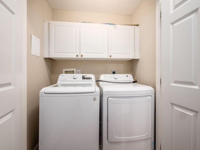 38 Ironclad Dr, Columbus, OH 43213 - laundry area with cabinet space and washing machine and clothes dryer
