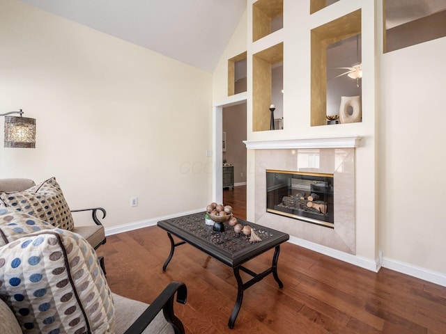 38 Ironclad Dr, Columbus, OH 43213 - living area featuring baseboards, wood finished floors, high vaulted ceiling, a ceiling fan, and a fireplace