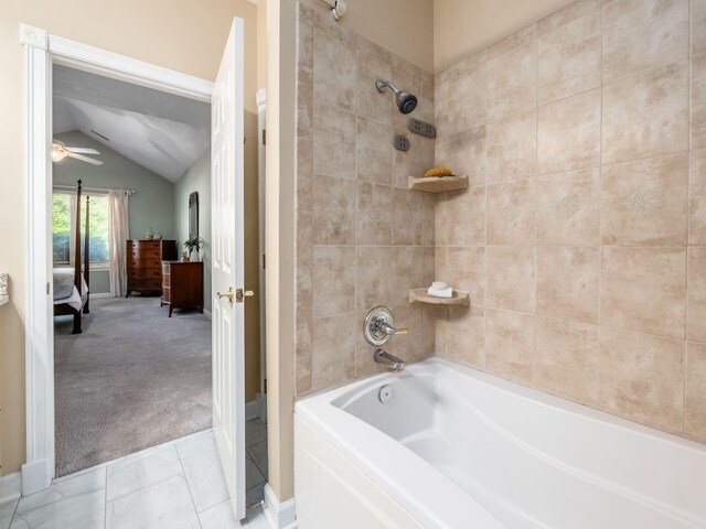 38 Ironclad Dr, Columbus, OH 43213 - ensuite bathroom featuring vaulted ceiling, washtub / shower combination, ceiling fan, and tile patterned flooring