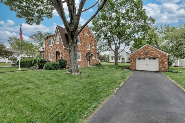 750 E Allen St, Lancaster, OH 43130 - view of property exterior featuring brick siding, a garage, and a lawn