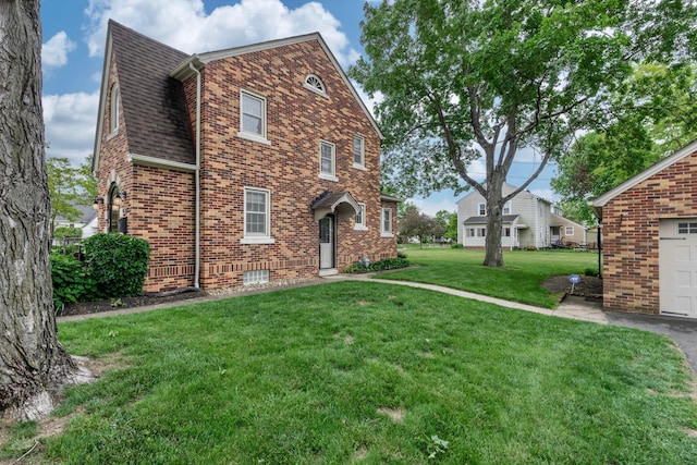 750 E Allen St, Lancaster, OH 43130 - view of property exterior featuring brick siding, a lawn, and a shingled roof