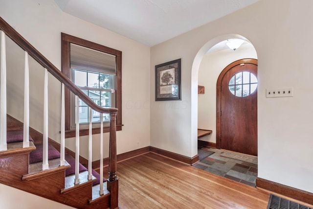 750 E Allen St, Lancaster, OH 43130 - entryway with arched walkways, plenty of natural light, baseboards, and wood finished floors