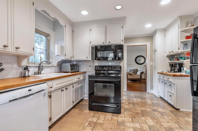 750 E Allen St, Lancaster, OH 43130 - kitchen with black appliances, a sink, butcher block countertops, stone tile flooring, and open shelves