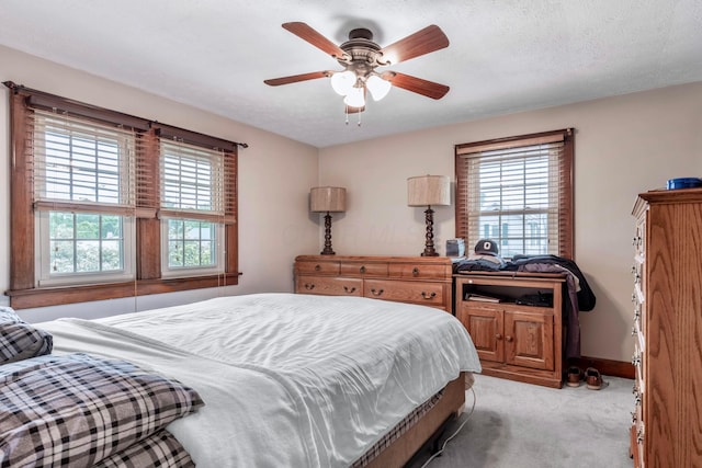 750 E Allen St, Lancaster, OH 43130 - bedroom featuring multiple windows, light colored carpet, ceiling fan, and baseboards
